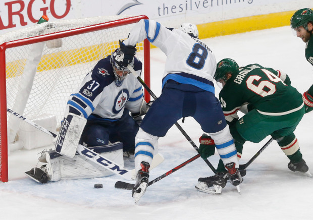 Connor Hellebuyck, Mikael Granlund, Jacob Trouba